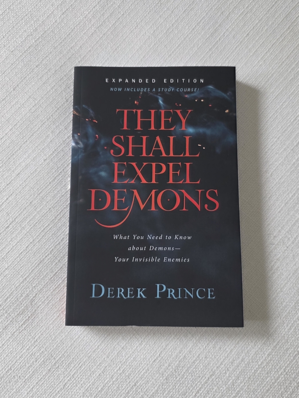 They Shall Expel Demons by Derek Prince - Black Cover with Red & Blue Text